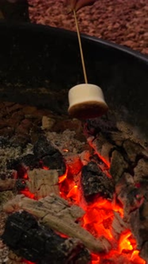 Close-up of a Marshmallow Roasting Over Glowing Campfire Embers