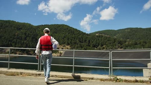 Landscape Engineer for Green Spaces Work Near the Dam Building Construction