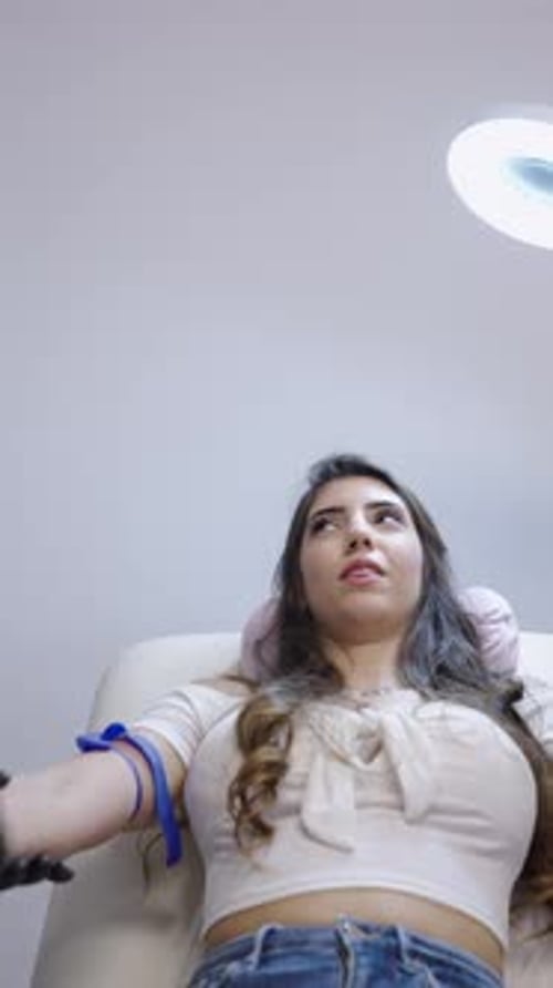 Woman Receiving Medical Attention in Hospital Clinic