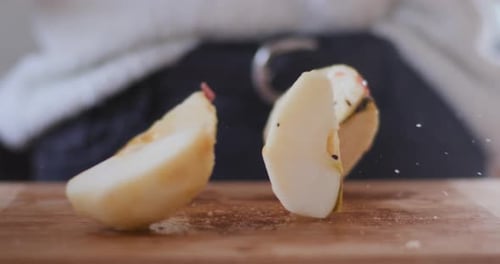 Peeled Apple Pieces Sliced Into Quarters On Table