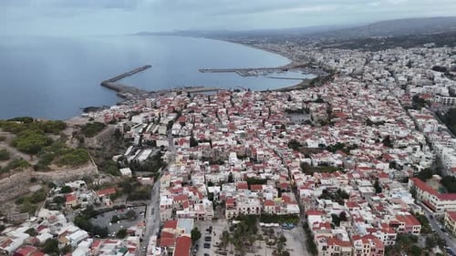 Aerial view flying over rethymno cityscape in greece