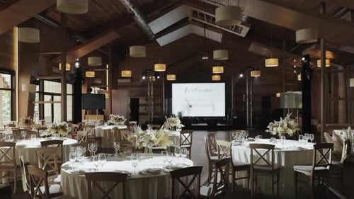 Elegant Wedding Reception Setup in a Spacious Indoor Venue