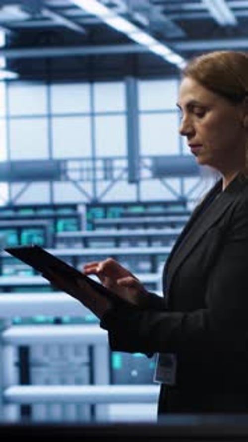 Vertical Video Woman Working in Data Center Housing Advanced Data Storage Infrastructure