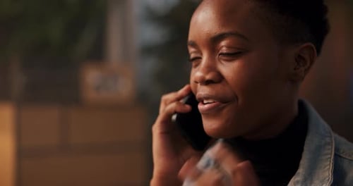 Woman Laughing and Talking on Cell Phone
