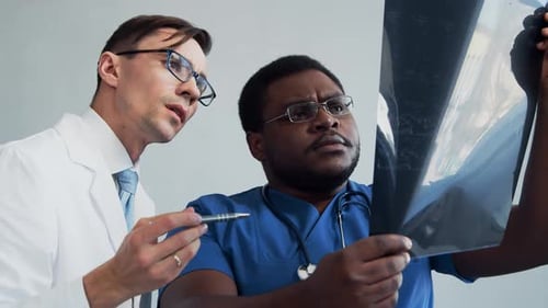 Doctor and Surgeon Talking Near Window Medical Workers in Hospital Office Day Light Healthcare