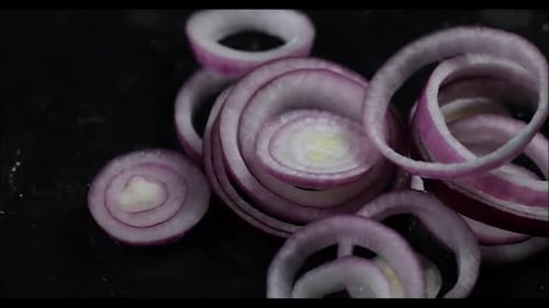 Red onions on a dark background