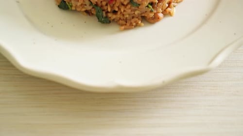 Fried Rice with Squid and Vegetables Served on Plate