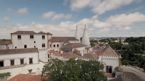 Cinematic panning shot of medieval royal residence, well preserved town palace of Sintra in Lisbon.