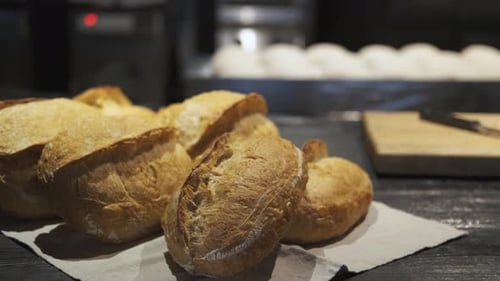 fresh baked bread and dough pieces for bread in a bakery