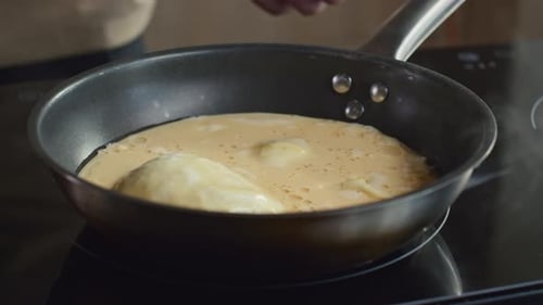 Eggs being cooked in a frying pan
