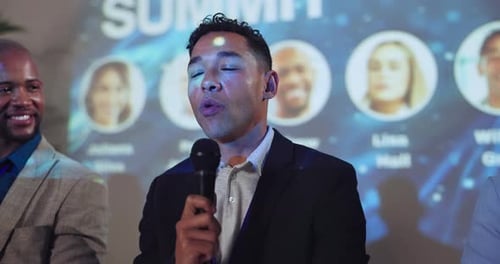 Adults Giving a Corporate Presentation with Technology Backdrop