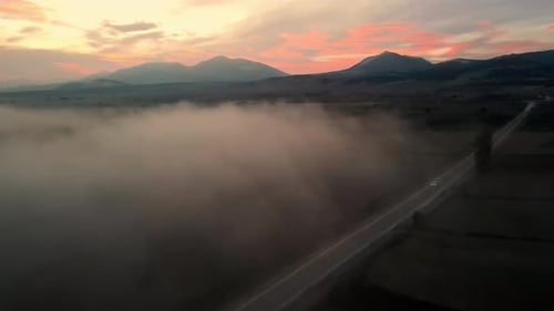 Foggy And Misty Road At Sunset