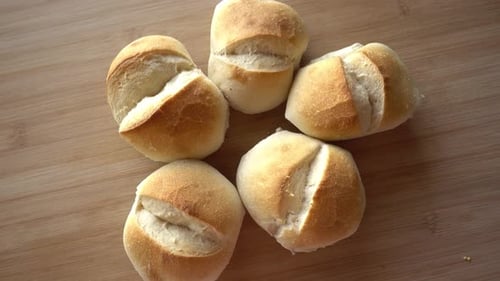 Freshly Baked Bread Rolls on Wooden Surface