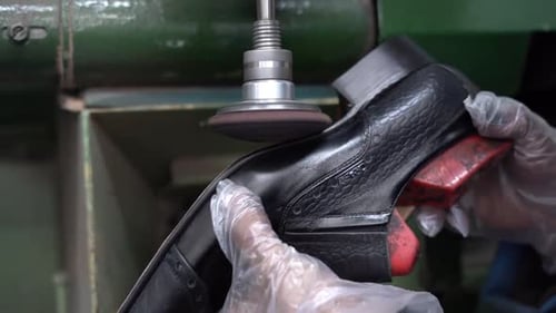 a craftsman handmade a shoe by a close up shot, insert shot