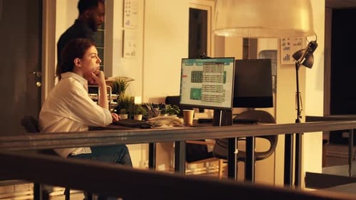 Company Employee Working with Stock Market Statistics