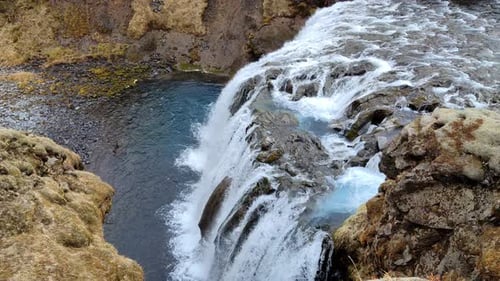 Beautiful Blue Water Waterfall From Above In Iceland