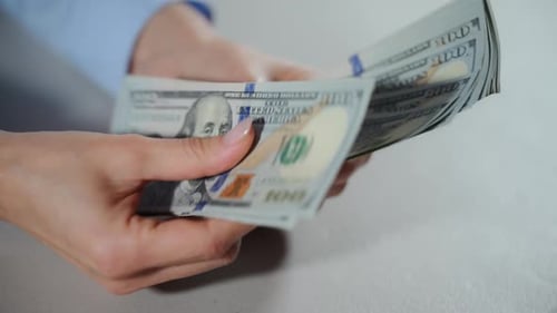 Close Up View of Female Hands Counting Money Holding Hundred Dollar Bills Slow Motion