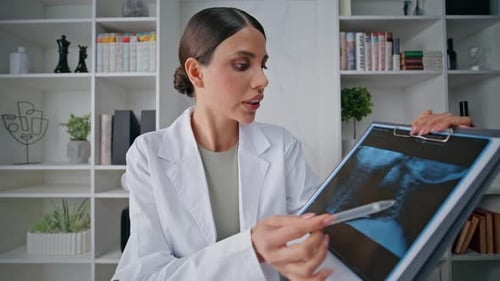 Radiology Expert Analyzing Xray at Tablet Showing in Webcam Pov Video at Clinic