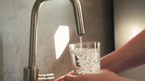 Filling A Glass With Water From The Tap