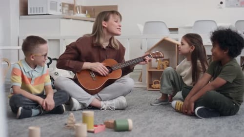 Young Woman Sings with Children, Playing Ukulele