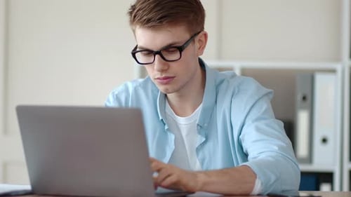 Serious Guy Thinking About New Business Strategy at Home Office