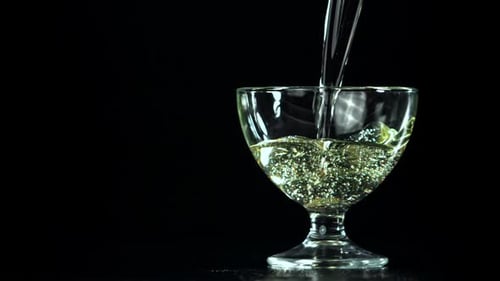 Sparkling Liquid Being Poured into Glass