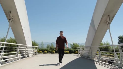 Walking Across Bridge