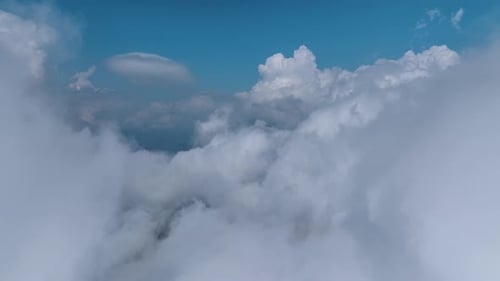 Aerial View Mystical Clouds Rolling Over a Hidden Mountain Forest