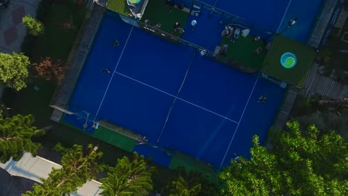 Aerial View Paddle Players Enjoy Scenic Courts Near the Mediterranean with Vibrant Matches and Sunny