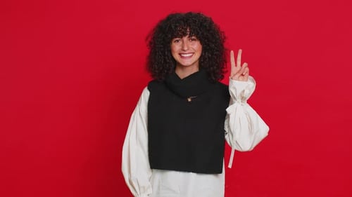 Smiling Woman Posing With Peace Signs