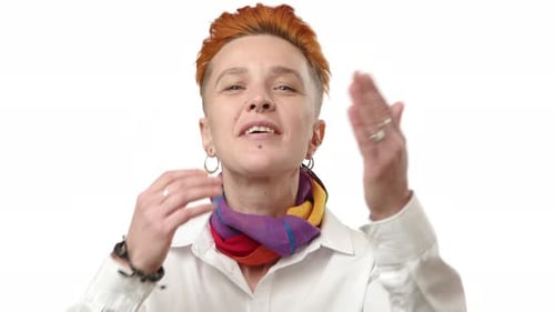 Young Adult with Orange Hair Blowing Kisses