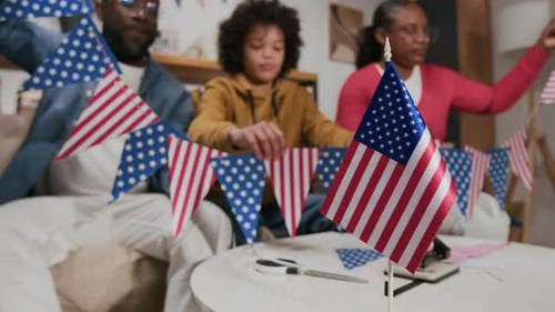 Family Making American Flag Decorations at Home