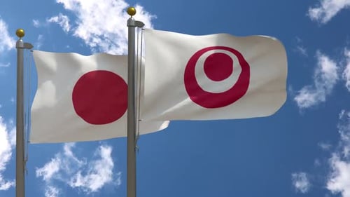 Waving Japanese Flag with Custom Emblem Against Blue Sky