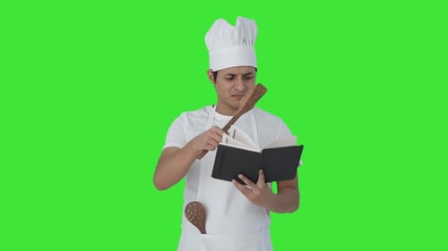 Disorganized Indian professional chef making food Green screen