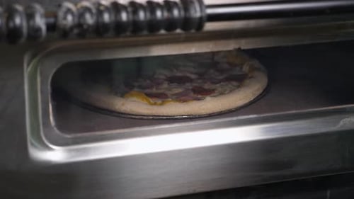 Pizza Baking Inside of a Commercial Oven