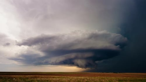Dramatic Storm Clouds Over Rural Field Landscape
