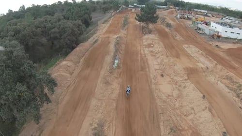 Motorcycle Rider on a Rural Dirt Track