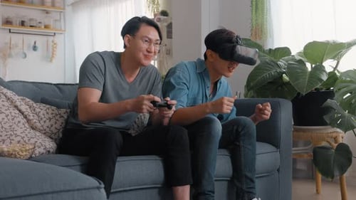 Happy young people playing video games on metaverse virtual digital technology