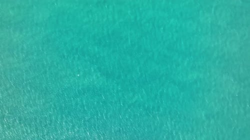 Ocean surface aerial view, sea water texture background by drone.