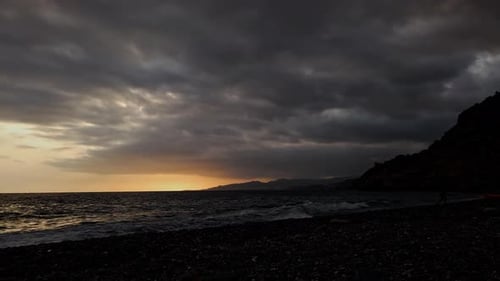 Sunset Timelapse at a Rocky beach in Spain 4k