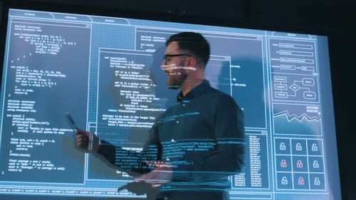 Talking about project. Male business trainer is against projector with data, teaching people.