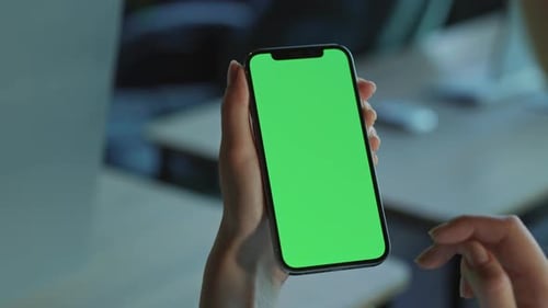 Footage of Beautiful Woman's Hands Holding Smartphone with Green Screen Shot of Female Office Worker