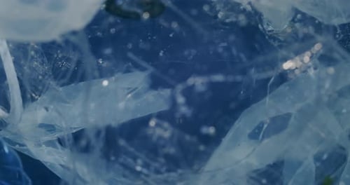 Close Up Of Rubbish Sea With Floating Plastic Garbages. Polluted Water Problem.