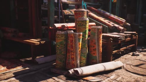Colorful Rugs Stacked in a Vibrant Market of a Small African Town