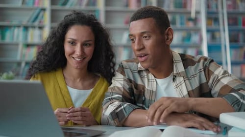 Two Ethnic Students Talking Working Together Laptop Project in University African American Man