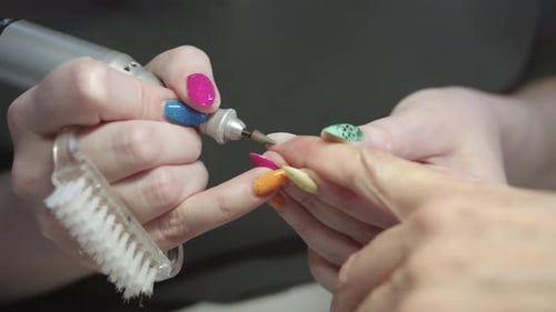 Nail Technician Giving Manicure in Beauty Salon
