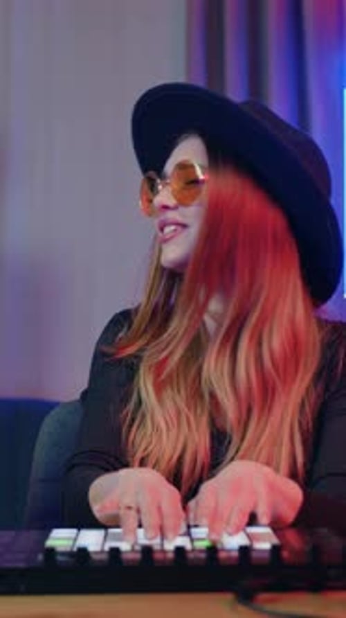 Young Woman Playing Keyboard and Singing at Home