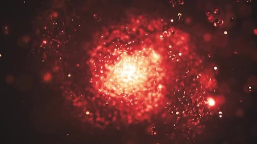 Abstract Swirling Red Particles with Central Bright Glow Loop