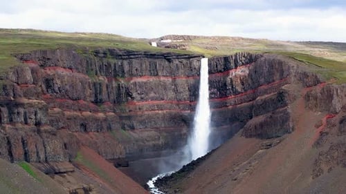 Aerial view of Hengifoss waterfall in rugged cliffs, Iceland.