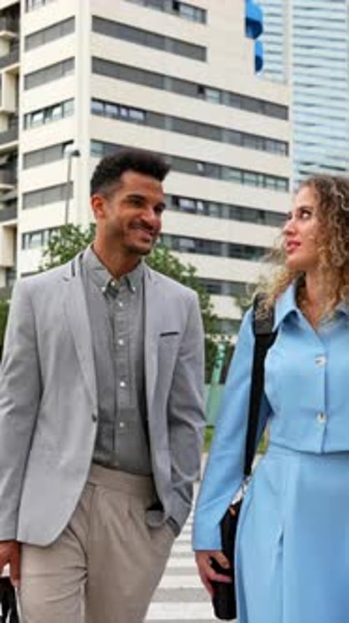 Professional Business Colleagues Walking and Talking in the City